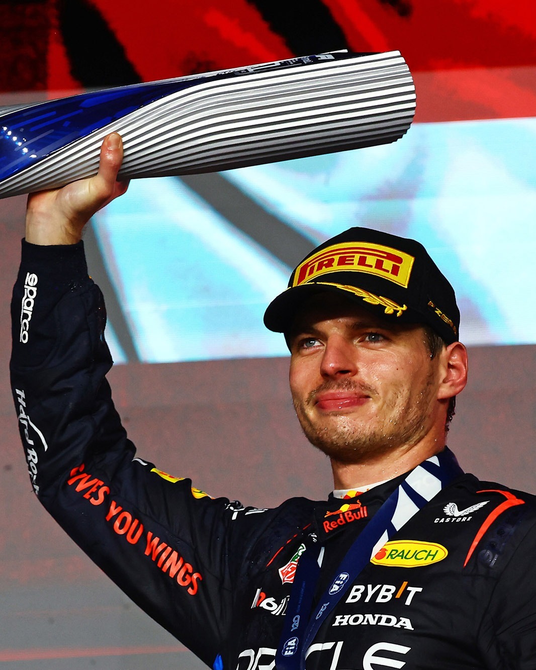 LUSAIL CITY, QATAR - DECEMBER 01: Race winner Max Verstappen of the Netherlands and Oracle Red Bull Racing celebrates on the podium during the F1 Grand Prix of Qatar at Lusail International Circuit on December 01, 2024 in Lusail City, Qatar. (Photo by Mark Thompson/Getty Images) // Getty Images / Red Bull Content Pool // SI202412010275 // Usage for editorial use only //